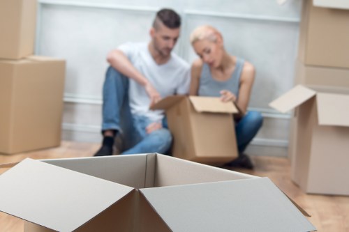 Removals team planning a move in Hounslow with packed boxes and furniture