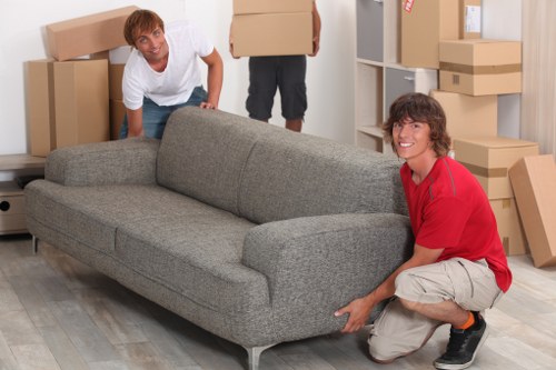 Loading furniture into a moving truck in Hounslow