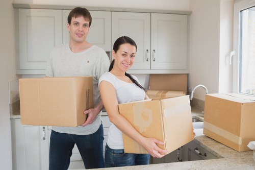 Unpacking service showing organised boxes and household items in a new property